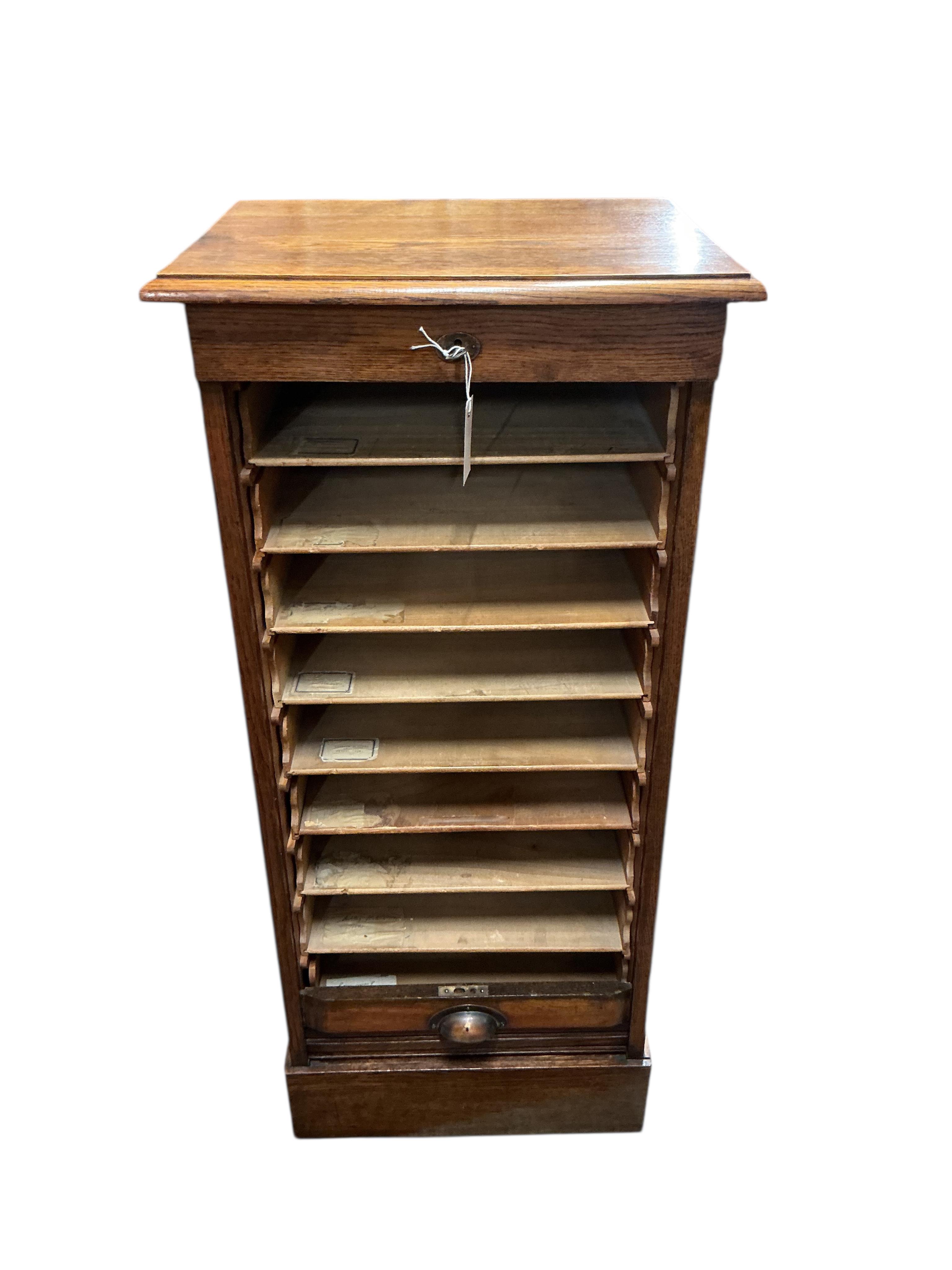 An early 20th century oak tambour filing cabinet, width 50cm, depth 39cm, height 111cm